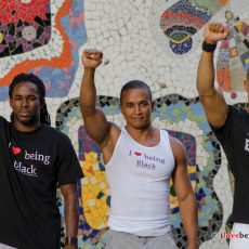 3 brothas with fists raised in Brazil